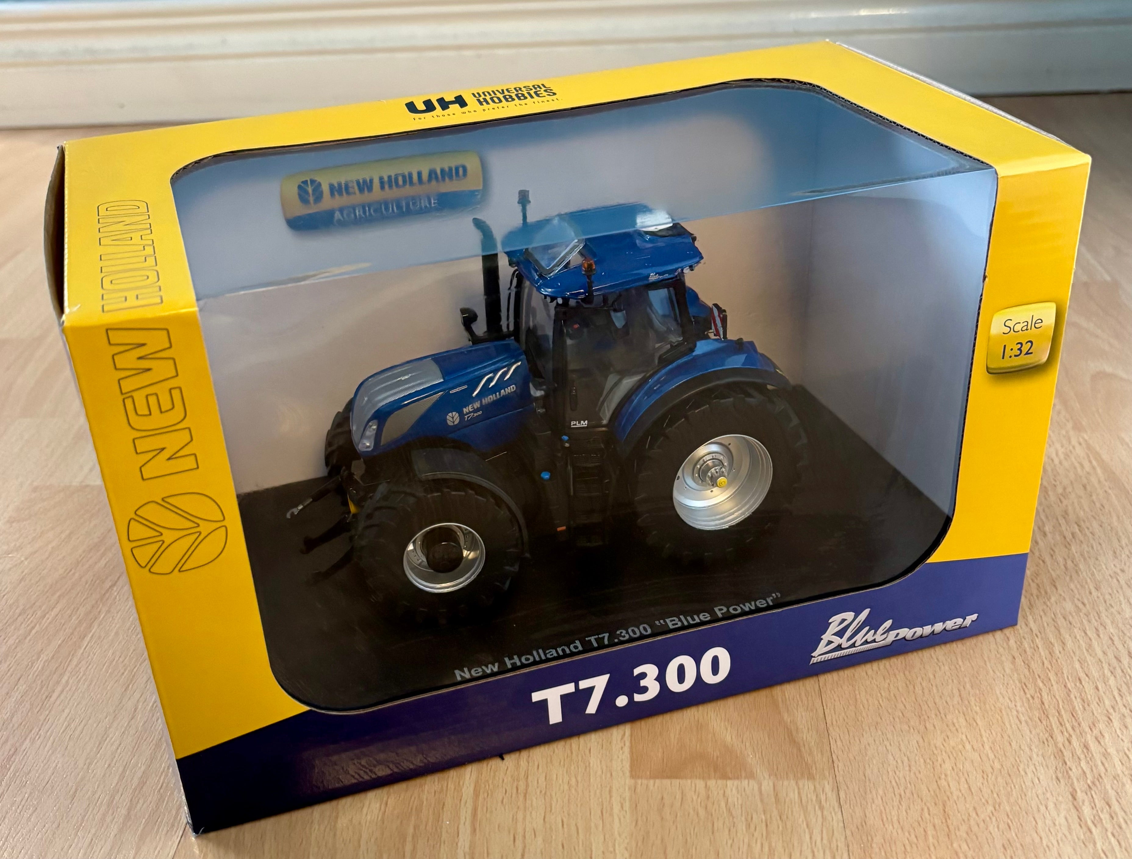 Universal Hobbies New Holland T7.300 Blue Power 1:32 Scale Tractor- Open Sunroof