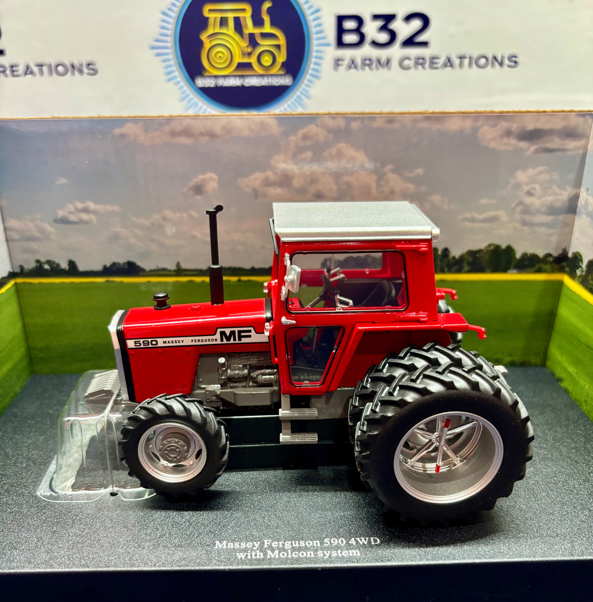UNIVERSAL HOBBIES 1:32 SCALE MASSEY FERGUSON 590 4WD WITH REAR DUAL WHEELS